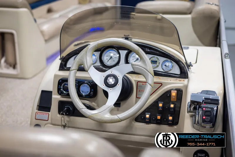 Slide: The Image of Steering console of 2012 Cypress Cay 250 Cozumel boat with gauges and controls. - 28