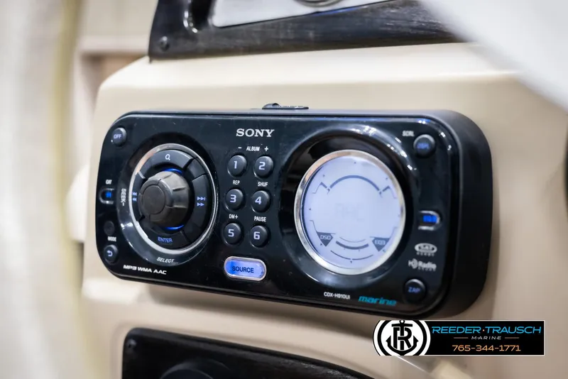 Slide: The Image of Sony marine stereo system on 2012 Cypress Cay 250 Cozumel boat dashboard. - 31