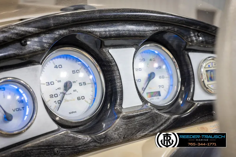 Slide: The Image of Dashboard of 2012 Cypress Cay 250 Cozumel boat with illuminated gauges. - 33