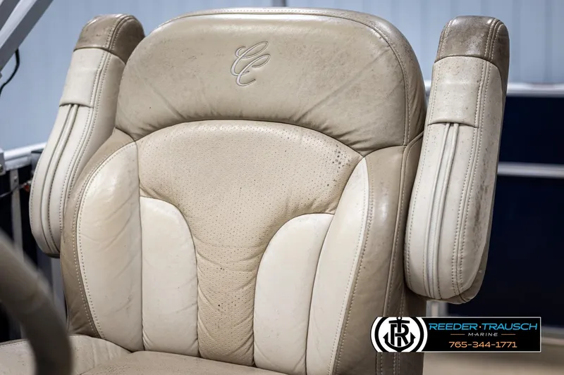 Slide: The Image of Cypress Cay 250 Cozumel 2012 boat seat with beige upholstery and logo detailing. - 37