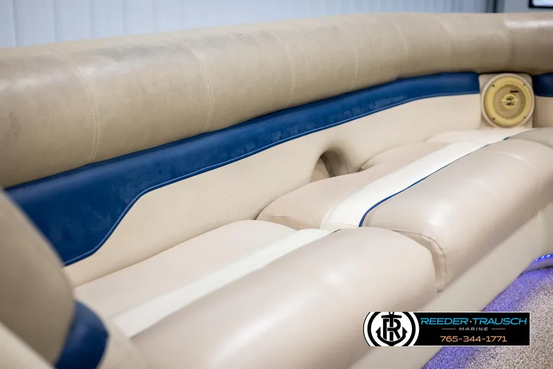 Slide: The Image of 2012 Cypress Cay 250 Cozumel boat interior with beige and blue seating. - 39