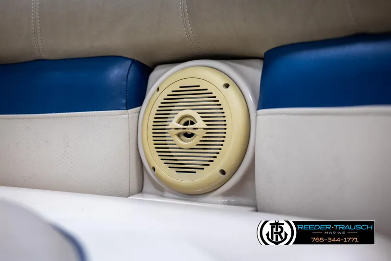 Slide: The Image of Speaker on 2012 Cypress Cay 250 Cozumel boat with blue and white seating. - 40