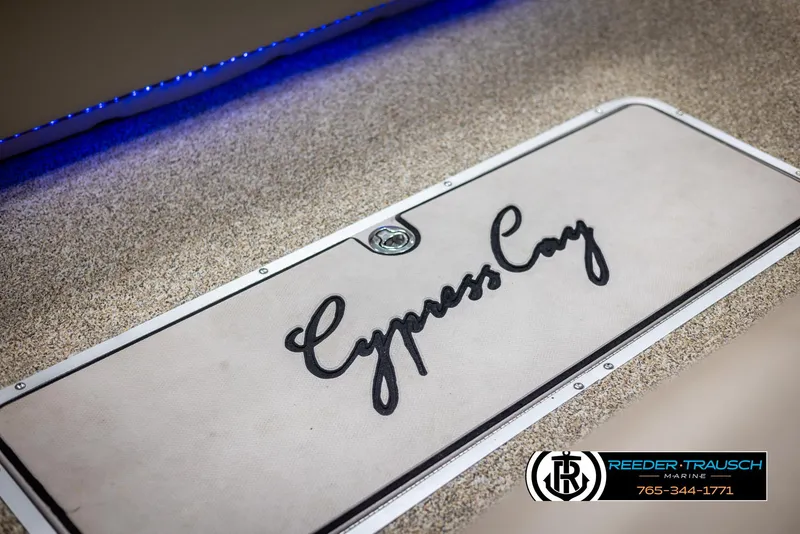 Slide: The Image of Cypress Cay 250 Cozumel 2012 boat deck with logo and Reeder-Trausch Marine branding. - 42