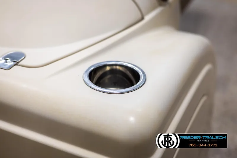 Slide: The Image of Cup holder on 2012 Cypress Cay 250 Cozumel boat, beige interior detail. - 43