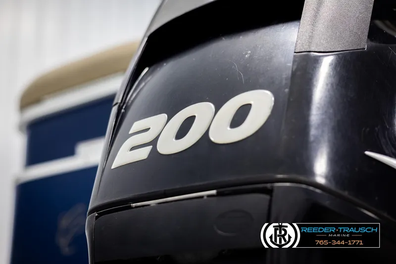 Slide: The Image of 2012 Cypress Cay 250 Cozumel boat engine with "200" label, Reeder-Trausch Marine logo visible. - 47