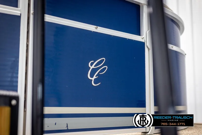 Slide: The Image of 2012 Cypress Cay 250 Cozumel boat with blue exterior and logo. - 49