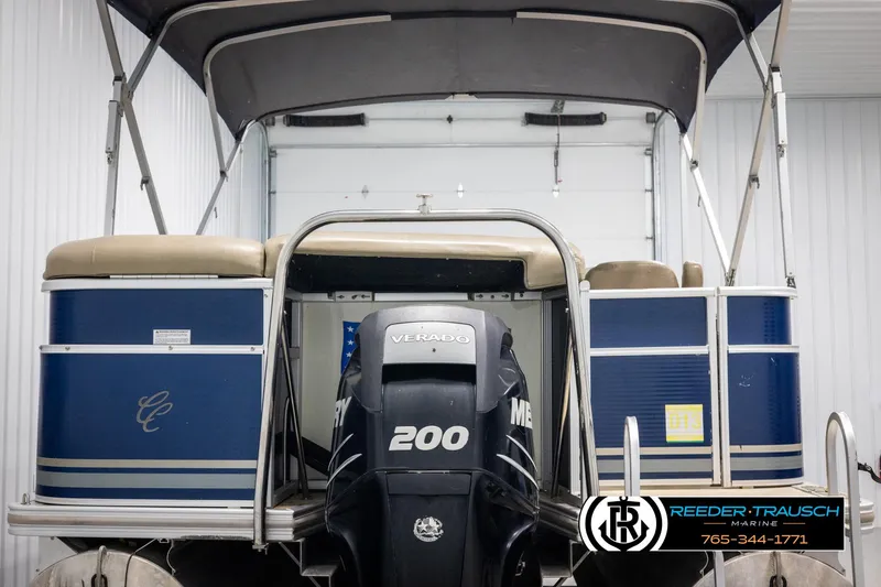 Slide: The Image of 2012 Cypress Cay 250 Cozumel pontoon boat with Mercury 200 engine in storage. - 7