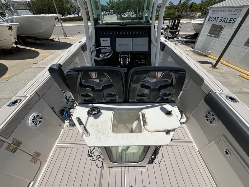 Slide: The Image of 2019 Wellcraft 262 Fisherman boat interior with dual seats and control panel. - 2