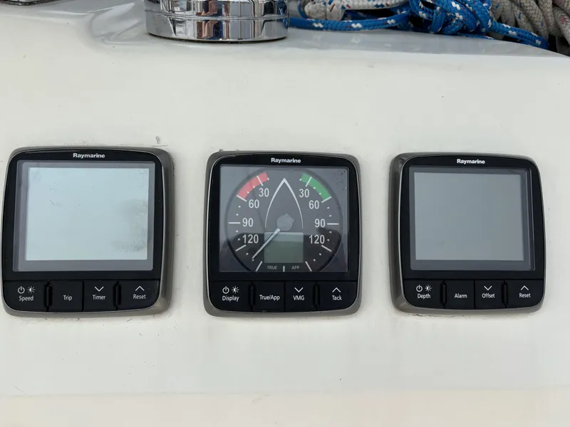 Slide: The Image of Raymarine navigation instruments on a 1990 Hunter 33.5 sailboat dashboard. - 25