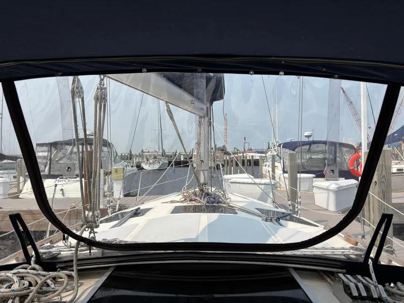 Slide: The Image of View from a 1990 Hunter 33.5 sailboat cockpit in a marina. - 26
