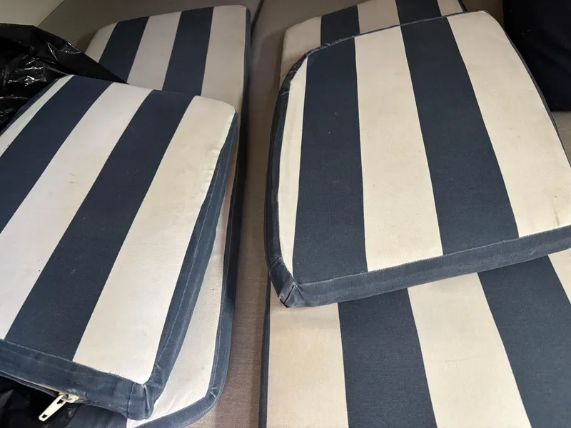 Slide: The Image of Blue and white striped cushions from a 1990 Hunter 33.5 boat. - 32