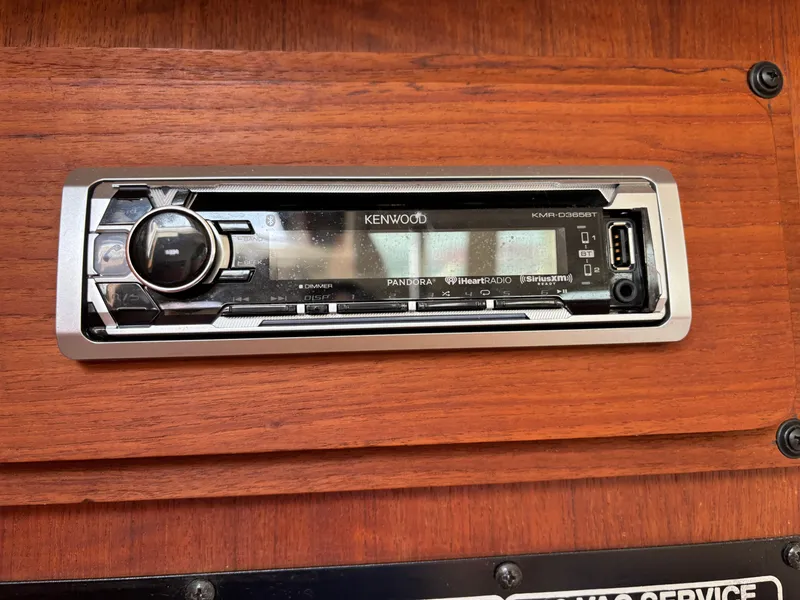 Slide: The Image of Kenwood stereo system in a 1990 Hunter 33.5 boat, mounted on wooden panel. - 41