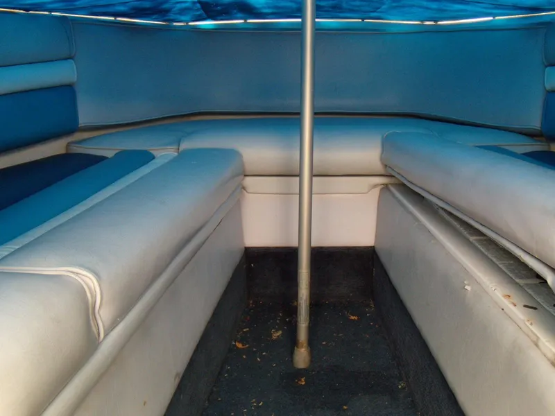 Slide: The Image of Interior of 1989 Chaparral 2300 SX Sport boat with blue and white seating. - 15