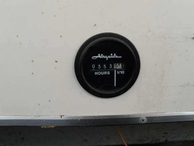 Slide: The Image of Hour meter on 1989 Chaparral 2300 SX Sport boat, reading 353.6 hours. - 19