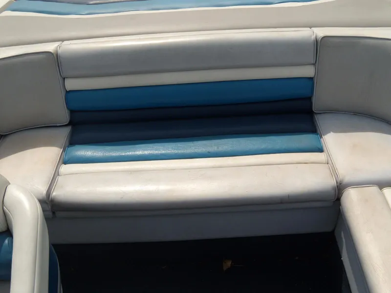 Slide: The Image of 1989 Chaparral 2300 SX Sport boat seating with blue and white upholstery. - 6
