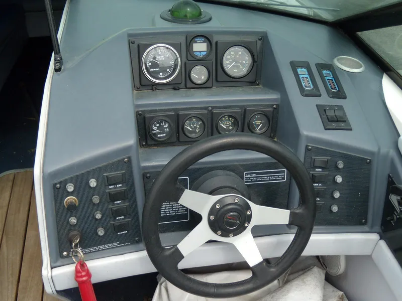 Slide: The Image of 1989 Chaparral 2300 SX Sport dashboard with steering wheel and instrument gauges. - 9