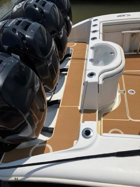 Slide: The Image of 2007 Yellowfin 36 boat deck with multiple outboard engines and seating area. - 18