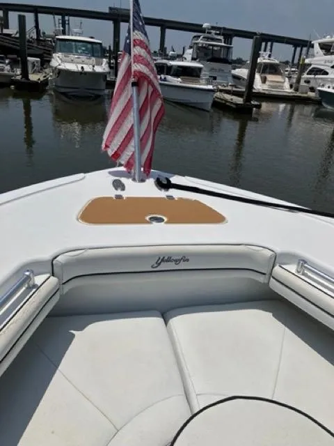 Slide: The Image of 2007 Yellowfin 36 boat with American flag, docked in marina. - 20