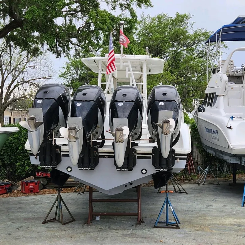 Slide: The Image of 2007 Yellowfin 36 boat with four powerful outboard motors, docked on stands. - 4