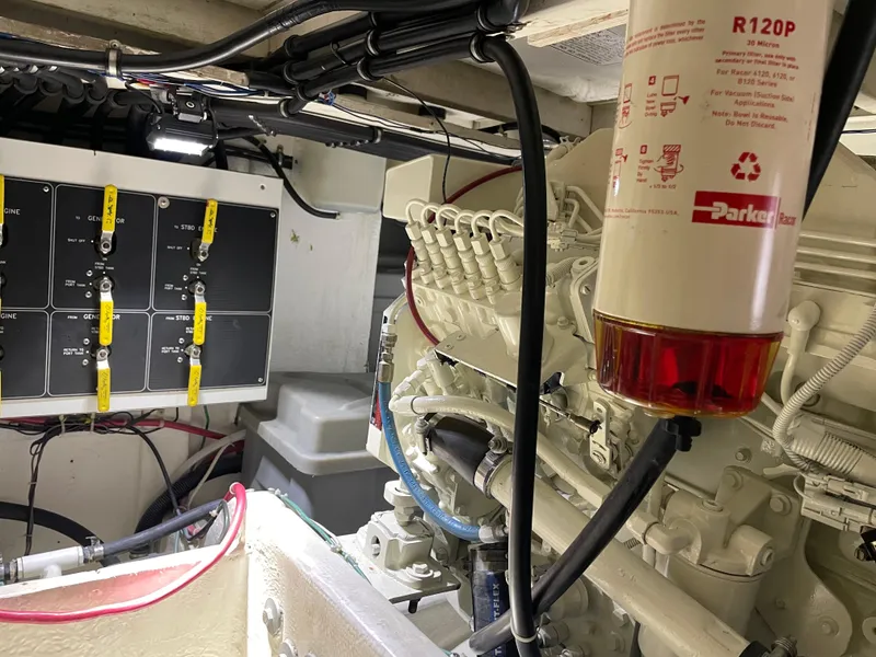 Slide: The Image of Engine room of 1998 Bayliner 4087 Aft Cabin Motoryacht with visible wiring and filter. - 29