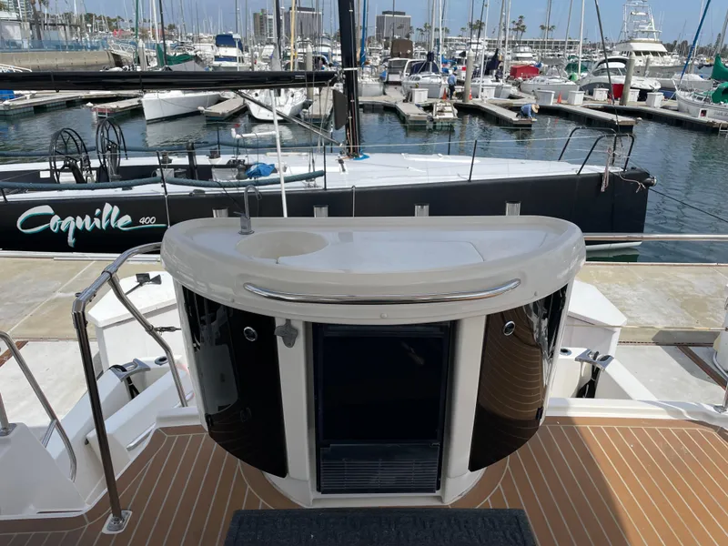 Slide: The Image of 1998 Bayliner 4087 Aft Cabin Motoryacht docked at marina, featuring sleek design and spacious deck. - 3