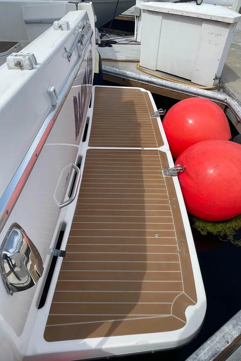 Slide: The Image of 1998 Bayliner 4087 Aft Cabin Motoryacht swim platform with red buoys. - 38