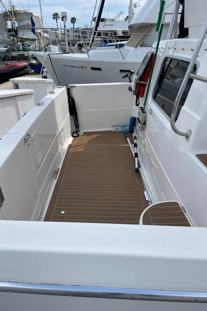 Slide: The Image of 1998 Bayliner 4087 Aft Cabin Motoryacht with spacious deck, docked at marina. - 5