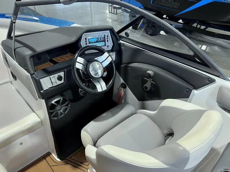 Slide: The Image of 2019 Tigé R23 boat interior with modern dashboard and steering wheel. - 10