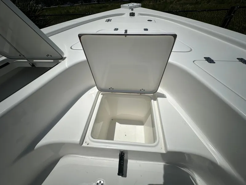 Slide: The Image of 2025 Sea Pro 230 Bay boat storage compartment with open hatch. - 10