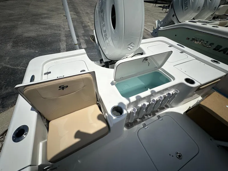 Slide: The Image of 2025 Sea Pro 230 Bay boat interior with open storage compartments and seating. - 14
