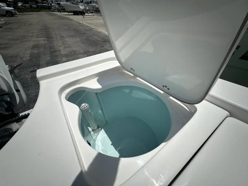 Slide: The Image of Open storage compartment on 2025 Sea Pro 230 Bay boat, showcasing interior space. - 15