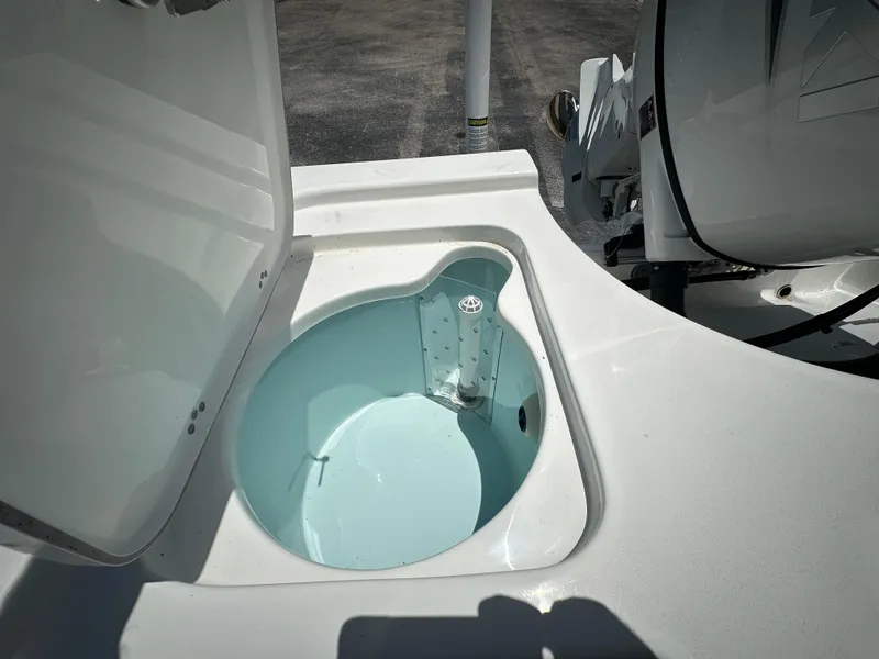 Slide: The Image of Open hatch on 2025 Sea Pro 230 Bay boat, revealing storage compartment. - 16