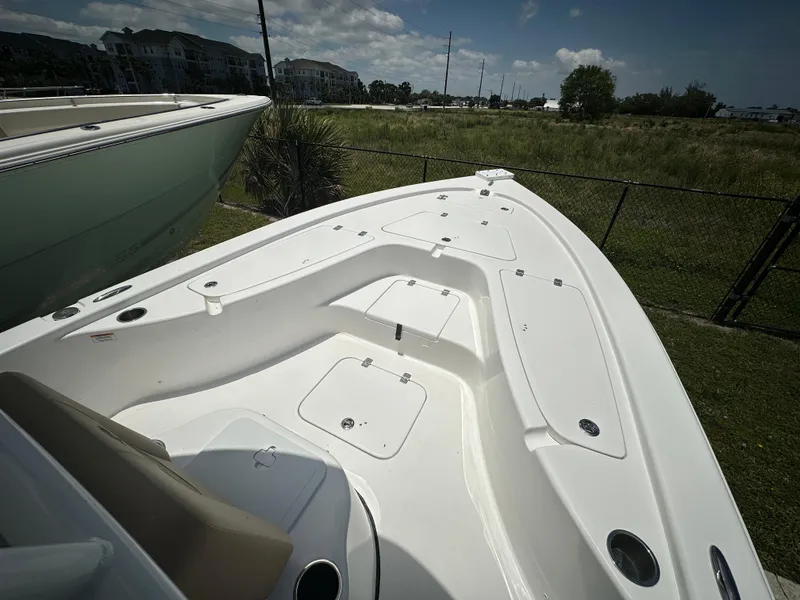 Slide: The Image of 2025 Sea Pro 230 Bay boat deck, spacious and sleek design, outdoor setting. - 6