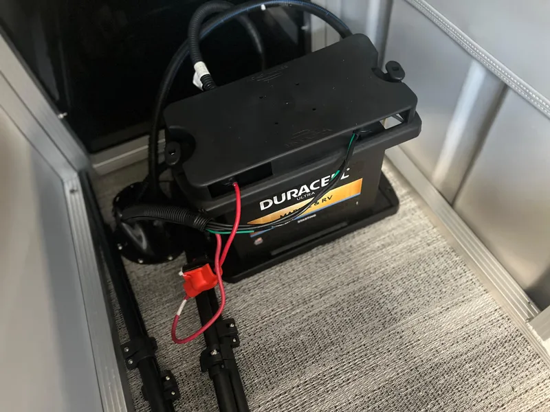 Slide: The Image of Battery setup in a 2025 Bennington 22SXSAPG boat, featuring a Duracell marine battery. - 14