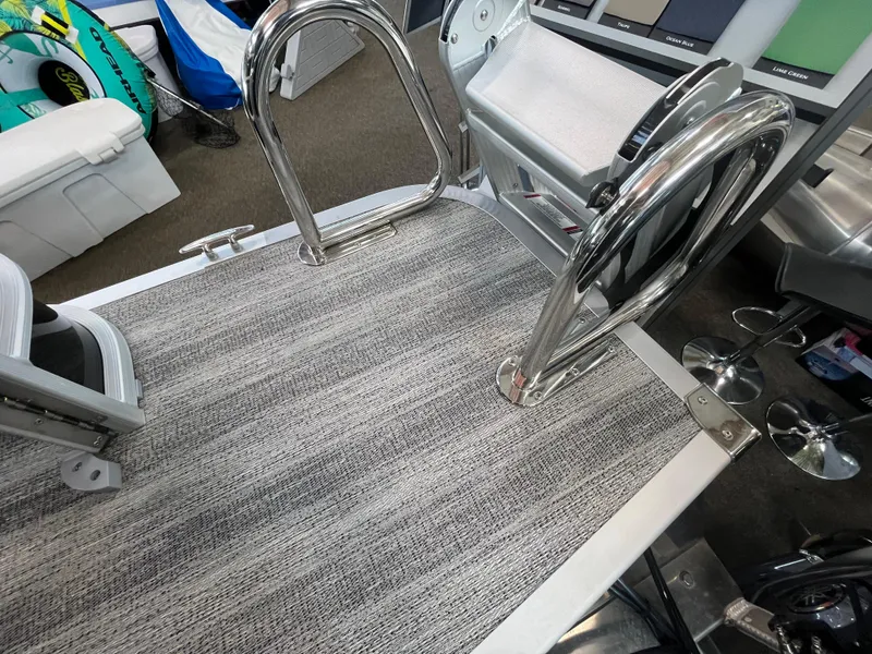 Slide: The Image of 2025 Bennington 22SXSAPG boat deck with stainless steel ladder and textured flooring. - 8