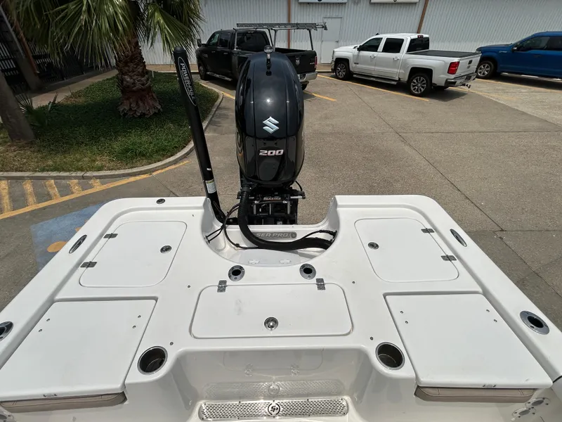 Slide: The Image of 2020 Sea Pro 228 Bay boat with Suzuki 200 engine in parking lot. - 10