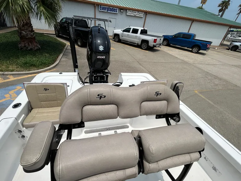 Slide: The Image of 2020 Sea Pro 228 Bay boat interior with Suzuki engine, parked in a lot. - 11