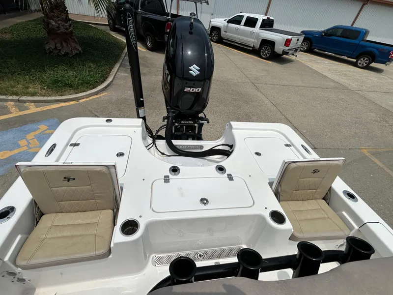 Slide: The Image of 2020 Sea Pro 228 Bay boat with Suzuki 200 engine, parked in a lot. - 12