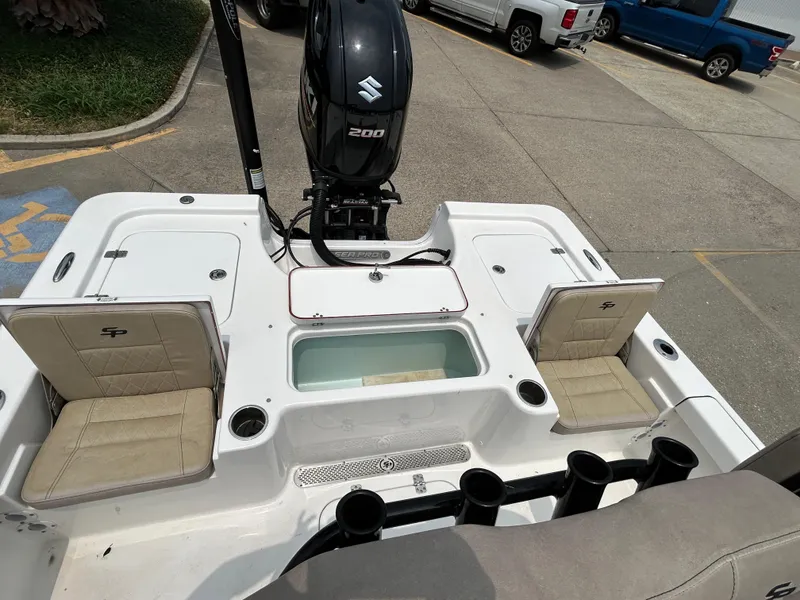 Slide: The Image of 2020 Sea Pro 228 Bay boat with Suzuki 200 engine, featuring seating and storage compartments. - 13