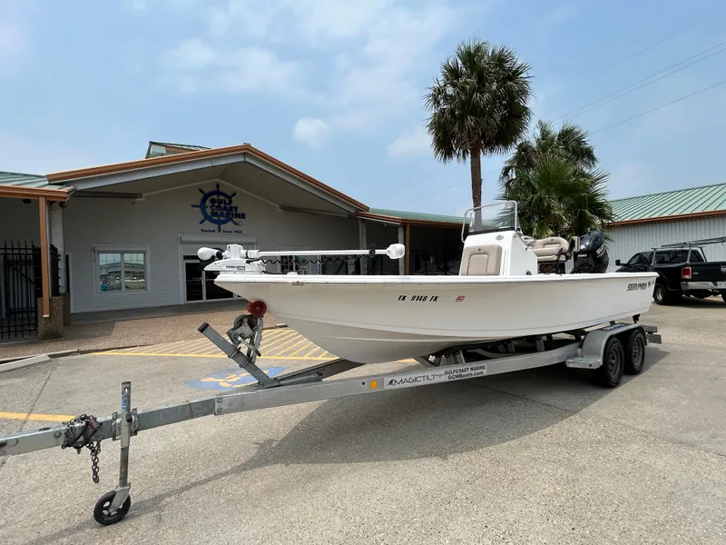 Slide: The Image of 2020 Sea Pro 228 Bay boat on trailer outside a marine dealership. - 5