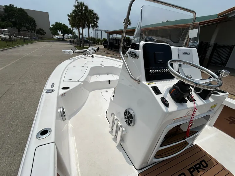 Slide: The Image of 2020 Sea Pro 228 Bay boat with steering console, docked outdoors. - 7