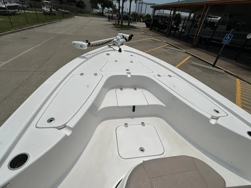 Slide: The Image of 2020 Sea Pro 228 Bay boat deck with storage compartments and trolling motor. - 8