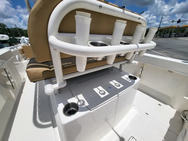 Slide: The Image of 2024 Bayliner Trophy T22CC boat interior with rod holders and seating. - 13