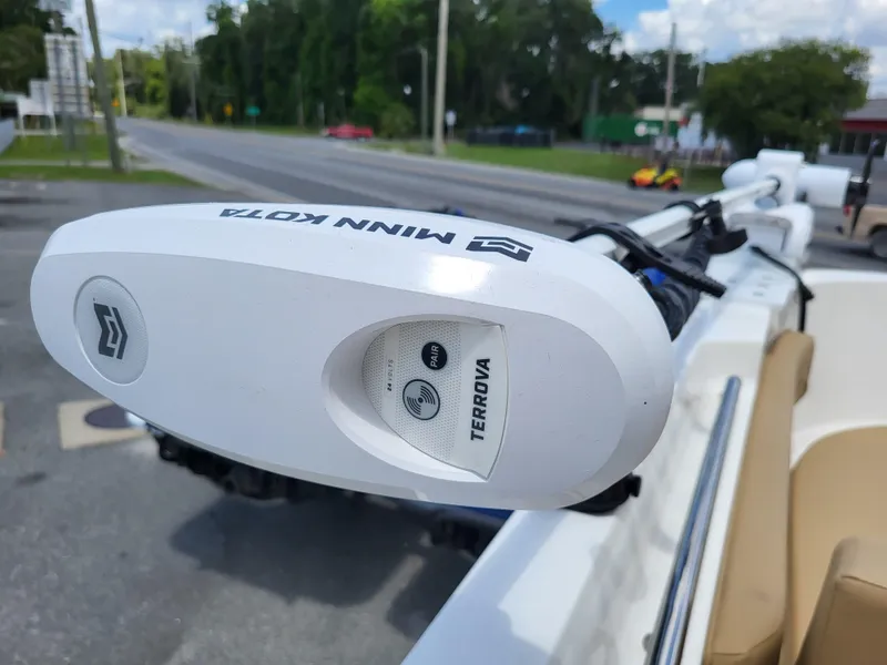 Slide: The Image of 2024 Bayliner Trophy T22CC with Minn Kota Terrova trolling motor on a sunny day. - 24