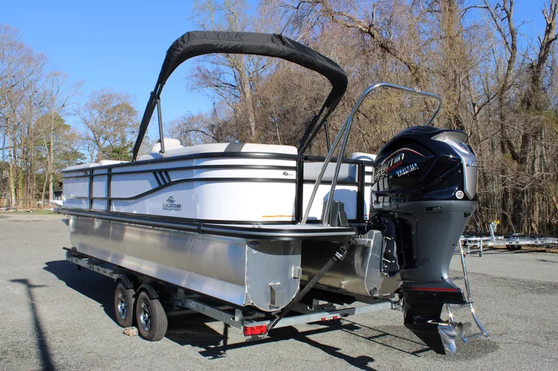 Slide: The Image of 2025 SunCatcher Select 324RC pontoon boat on trailer, featuring Yamaha outboard motor. - 5