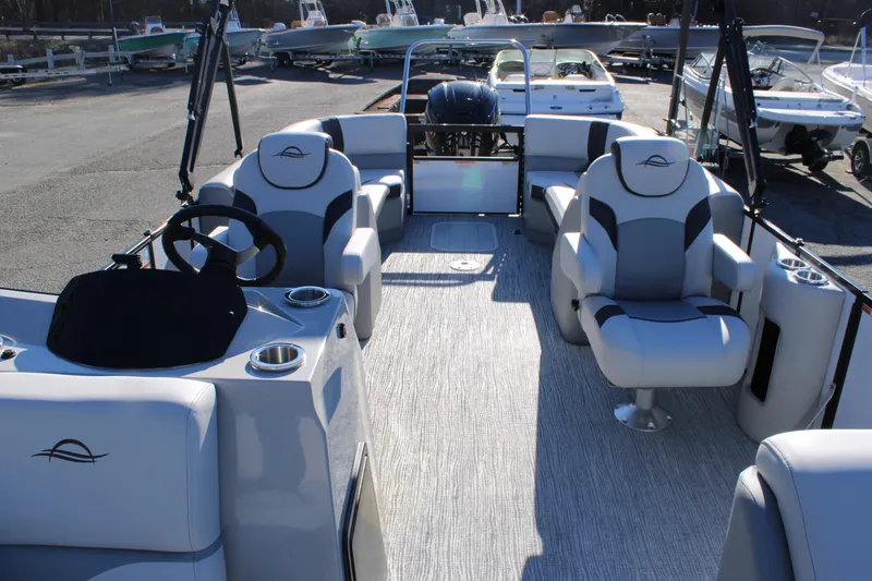 Slide: The Image of 2025 SunCatcher Select 324RC pontoon boat with luxurious seating and modern design. - 8
