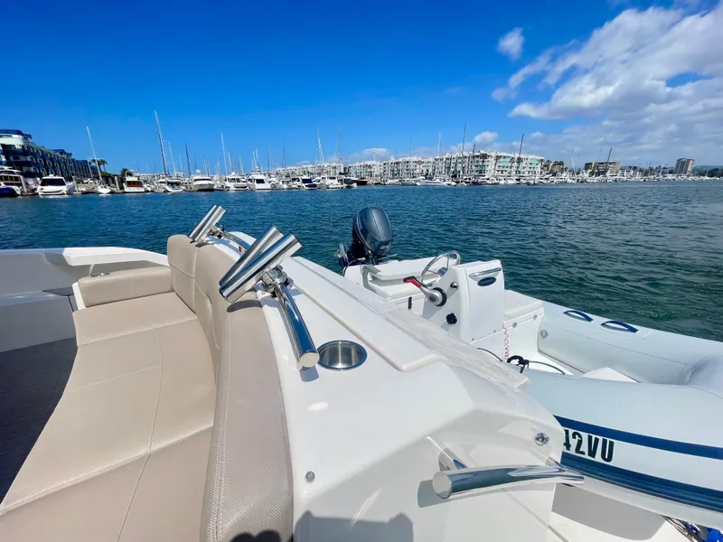 Slide: The Image of 2017 Tiara Yachts 44 Coupe docked in a marina with clear blue skies. - 17