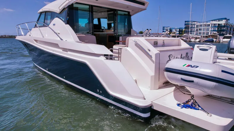 Slide: The Image of 2017 Tiara Yachts 44 Coupe docked, featuring sleek design and modern amenities. - 2