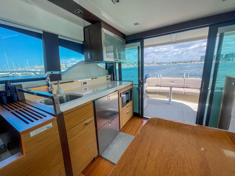 Slide: The Image of Luxurious interior of 2017 Tiara Yachts 44 Coupe with ocean view and modern kitchen. - 21