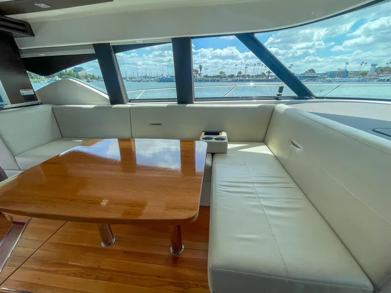 Slide: The Image of Luxurious interior of 2017 Tiara Yachts 44 Coupe with elegant seating and wooden table. - 26
